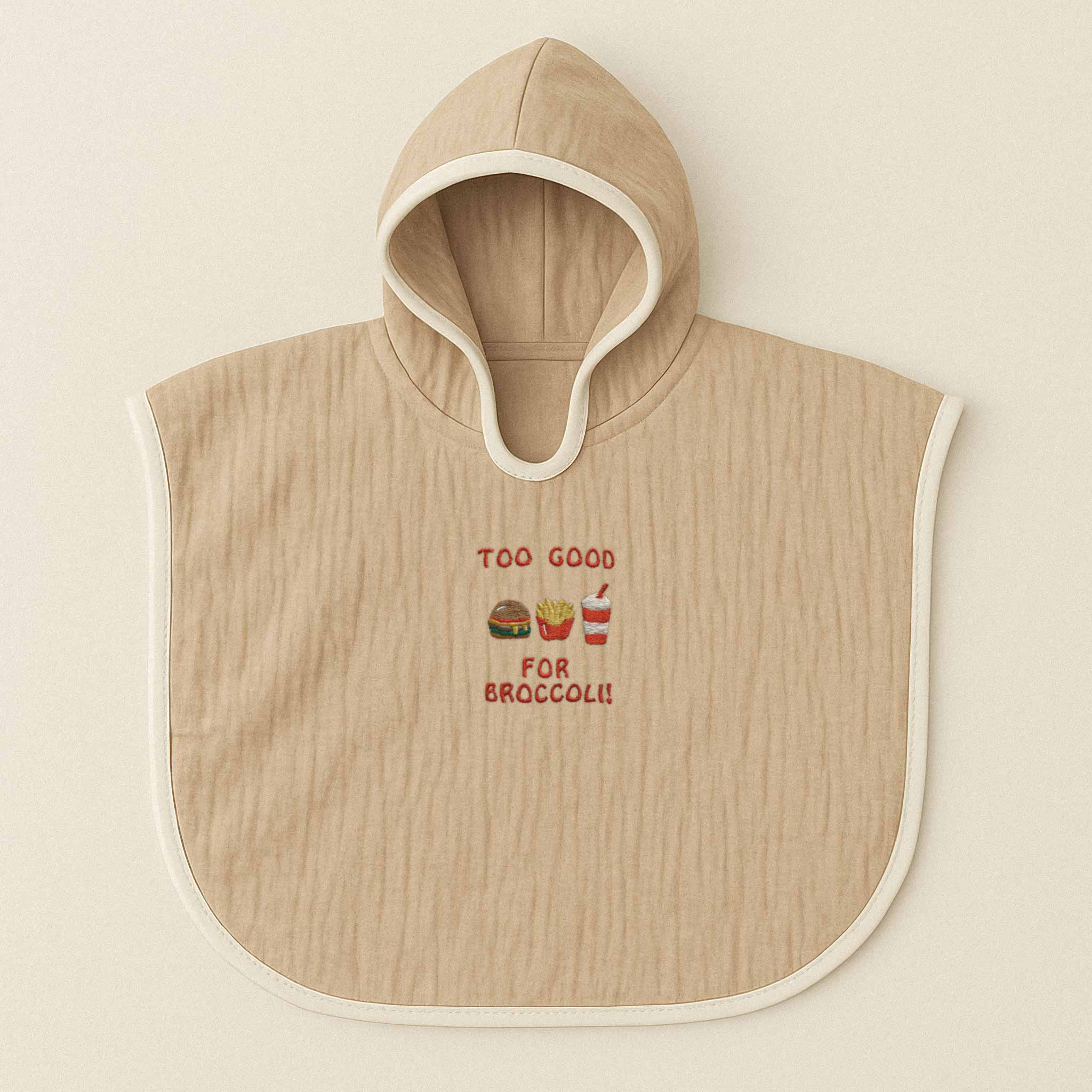 Somon rengi (bej), kapüşonlu, müslin kumaştan bebek ve çocuk pançosu. Göğüs kısmında "Too Good for Broccoli" yazısı ve hamburger, patates kızartması, içecek nakışları bulunmaktadır.